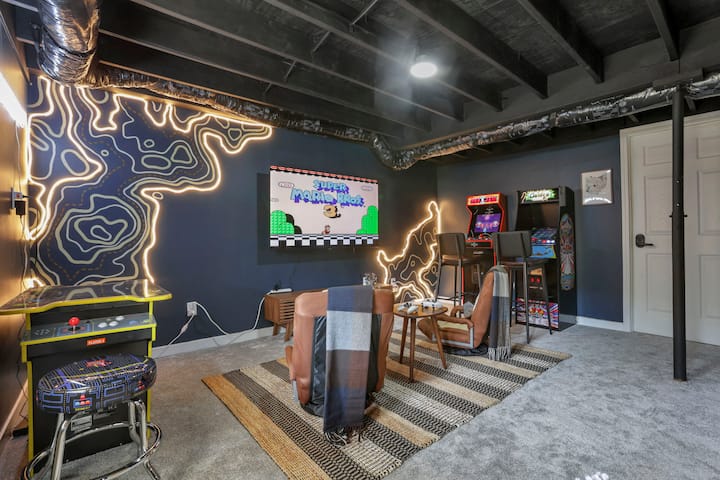 Retro arcade room with Pac-Man cabinet and neon lighting