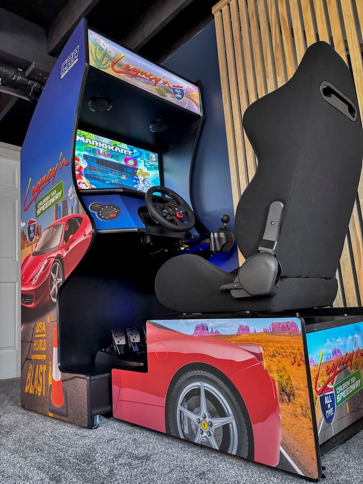 Open-concept entertainment area with racing arcade