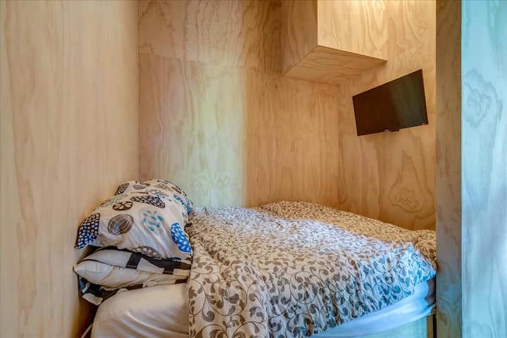 Tiny home bedroom with queen bed