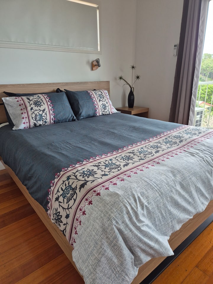 Expansive Master Bedroom with queen size bed.