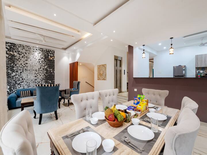 • Elegant Dining Area with Modern Interior & Cozy Seating
• Stylish Table Setup Perfect for Family Meals & Gatherings
• Contemporary Open Kitchen View with Warm Lighting Ambience
• Spacious & Comfortable Space Designed for Relaxed Dining Experiences