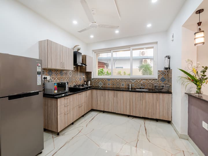 • Modern Modular Kitchen with Elegant Wooden Cabinets
• Spacious Cooking Area with Premium Countertop & Stylish Tiles
• Bright & Well-Ventilated Interior with Contemporary Design
• Fully Functional Kitchen Space Ideal for Comfortable Daily Living