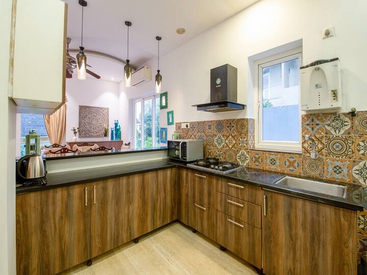 • Modern Modular Kitchen with Elegant Wooden Cabinets
• Spacious Cooking Area with Premium Countertop & Stylish Tiles
• Bright & Well-Ventilated Interior with Contemporary Design
• Fully Functional Kitchen Space Ideal for Comfortable Daily Living