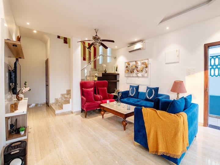 • Stylish Modern Living Room with Elegant Blue Sofa Seating
• Contemporary Interior Design with Artistic Wall Décor
• Bright & Cozy Lounge Space with Premium Furnishings
• Perfect Setting for Relaxation, Conversations & Comfortable Living