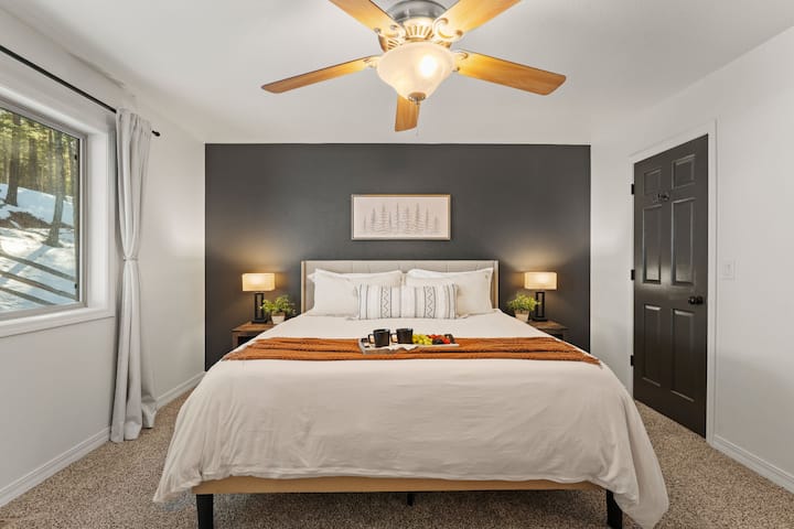 Primary Suite with King bed and attached spacious 5 piece bathroom.
