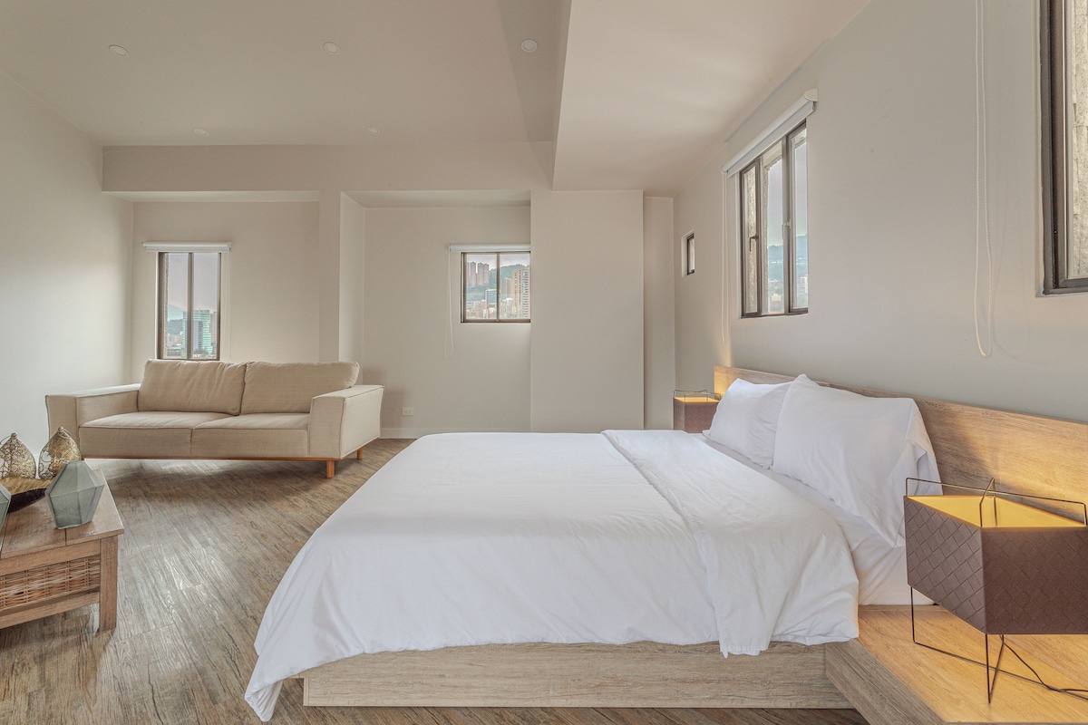 King bedroom with terrace access and mountain views