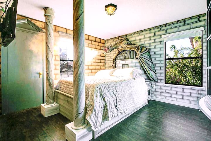 Up close the Gringotts Ukrainian Ironbelly fills the wall — scaled wings spread wide, claws gripping a stone turret above your pillow. It smokes. It roars. Even the grown-ups pause in the doorway.