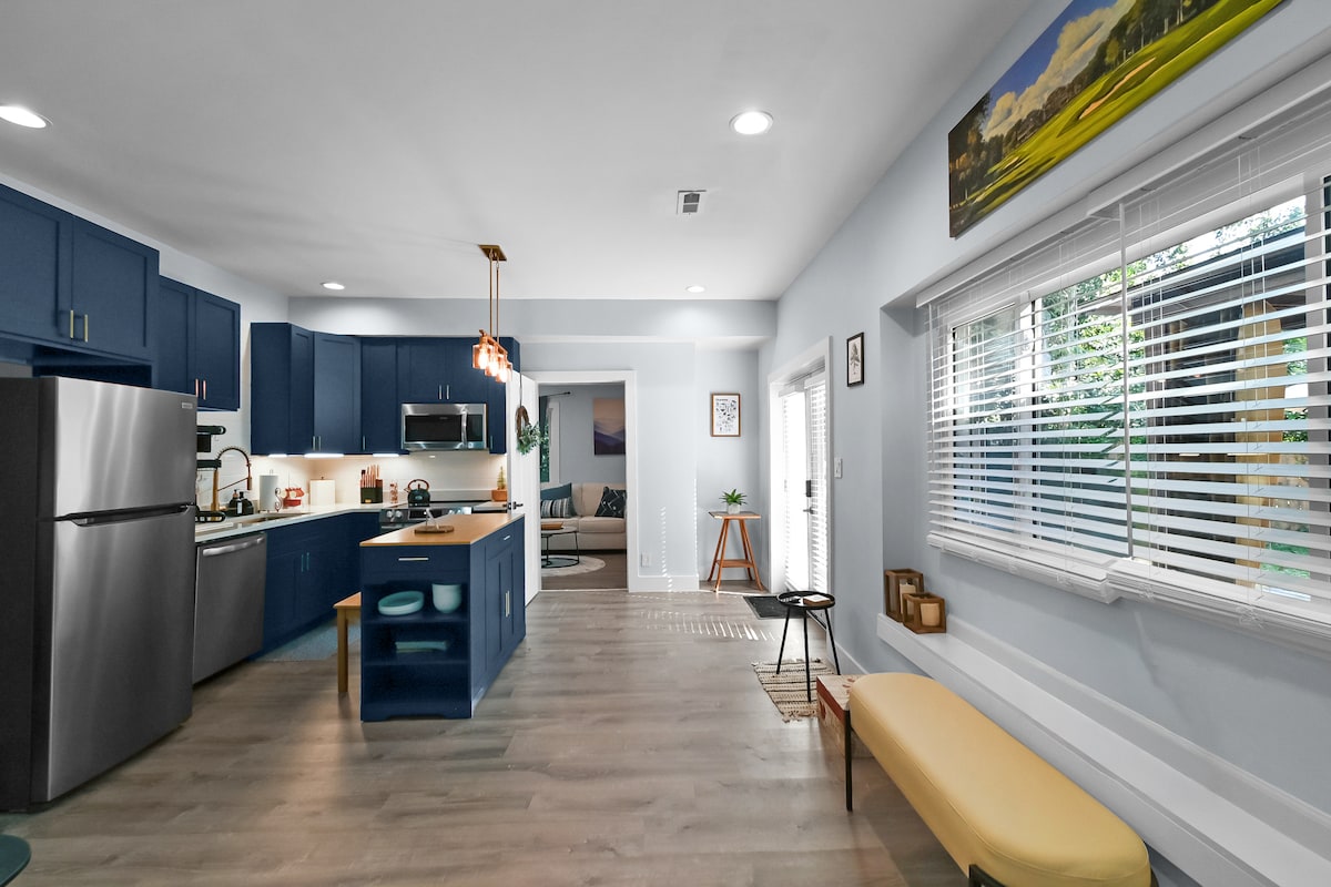 Suite kitchen with navy cabinets