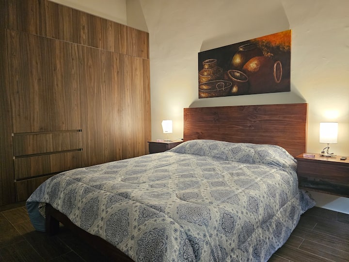 Rustic room with wood-colored ceilings and natural light. Equipped with a 55" Smart TV, recliner, closet and fan. Includes blackout blinds for a total rest. Spacious, cool and cozy space. Your perfect retreat!