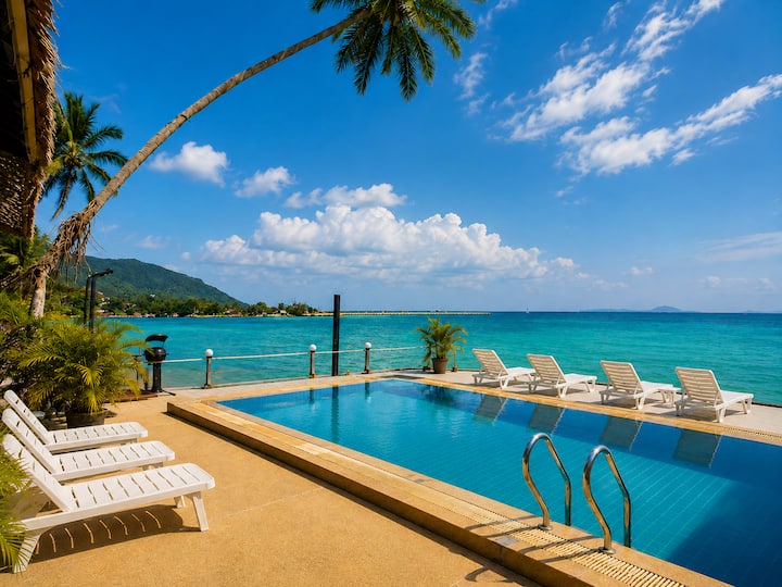 Sunset beach room with oceanfront pool