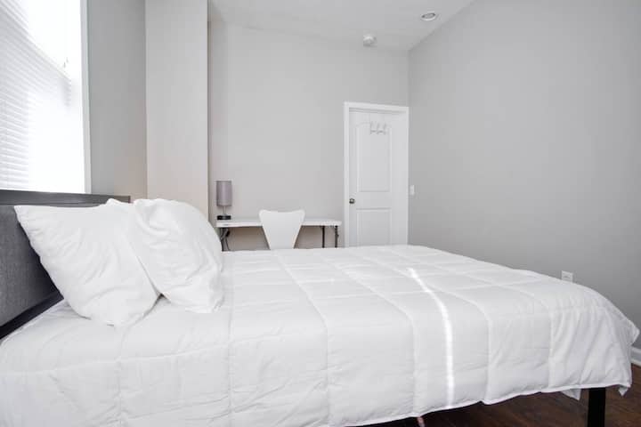 Full Size bed, Desk with chair, Closet with hangers and vertical closet for folding clothes. 2 bedside tables, each with usb charging ports.