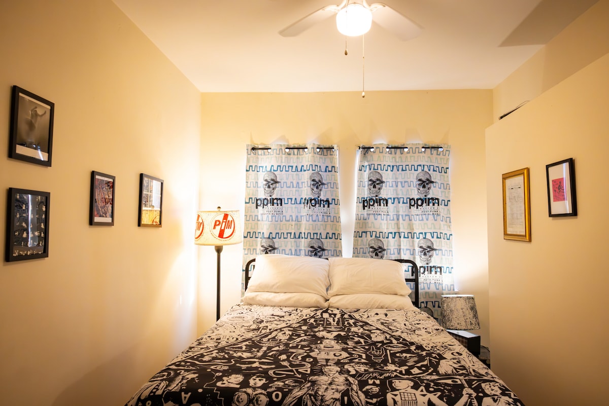 (14'x8') This room has more of a Chicago flavor with a cocktail table from Club Neo, and deeper artifacts from Wax Trax, Lead Into Gold Album photographs, and a manual typewriter.