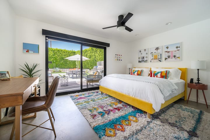 Thoughtful details like bedside phone chargers, a sound machine, and electric blackout shades ensure both productivity and rest. Slide open the glass doors to feel instantly connected to the poolside lounge, or enjoy the view while laying in bed.