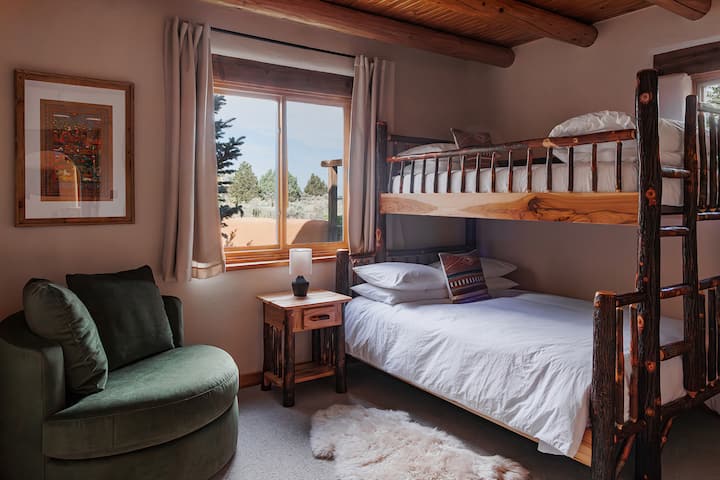 Solid hickory wood Amish craftsmanship, soft organic bedding, and a cozy reading nook make this twin over full bunk room a favorite for all ages.