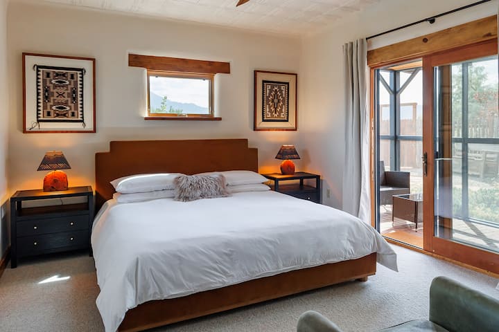 This calming casita bedroom features a king organic bed, with premium organic bedding, blending clean comfort with elevated Southwest style.