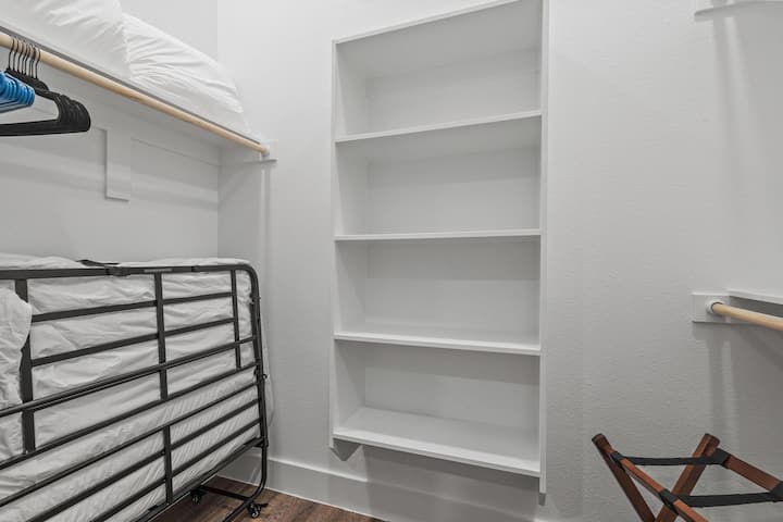 Large Walk-in closet with a stored fold out Twin Bed