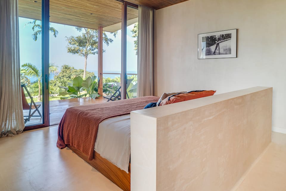 Master bedroom with panoramic ocean view at Casa Kasbah