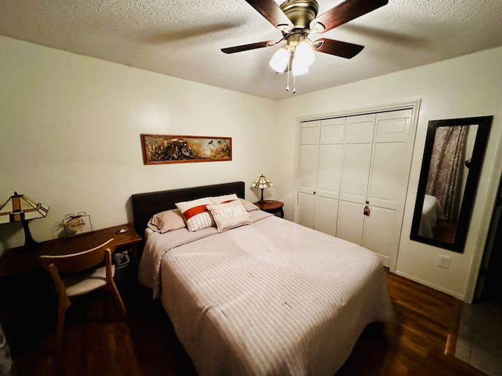Bedroom 4 upstairs, queen bed, small desk, attached bathroom