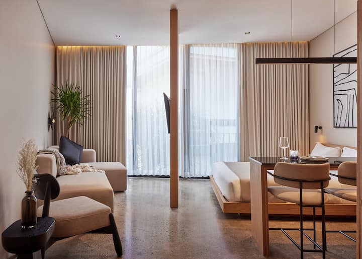 A serene bedroom that blends tropical warmth with modern design. Perfect for lazy mornings and restful nights in Canggu.