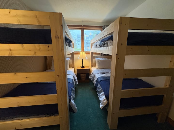 Sturdy carpenter-made bunks have twin XL mattresses to accommodate kids and adults.