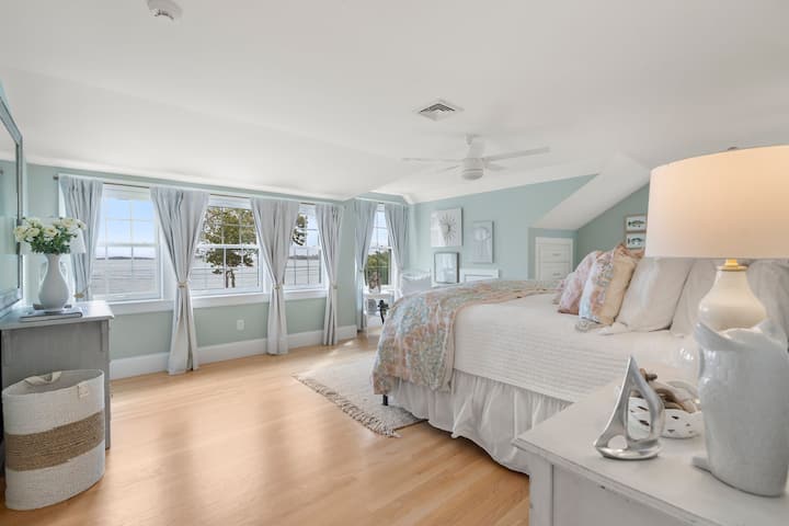 2nd floor bedroom with king bed, closet, and amazing water views.