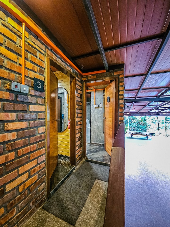 Welcome to Room 3. Step through the wood door and check out the common area before retreating to your space.