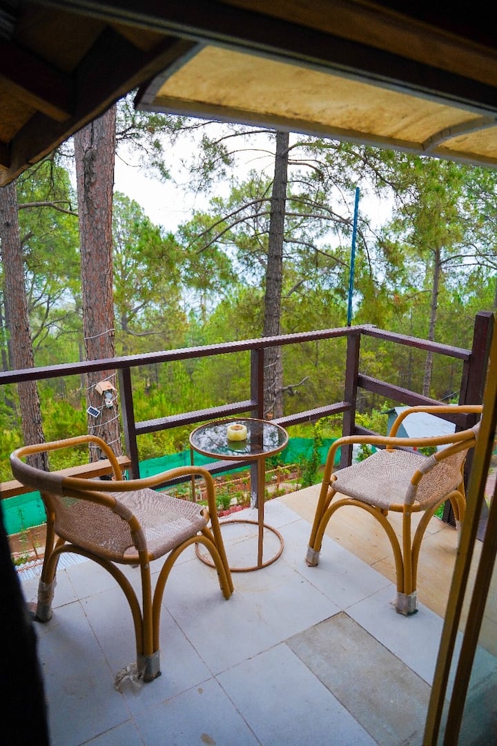 Balcony with scenic mountain and pine tree views
