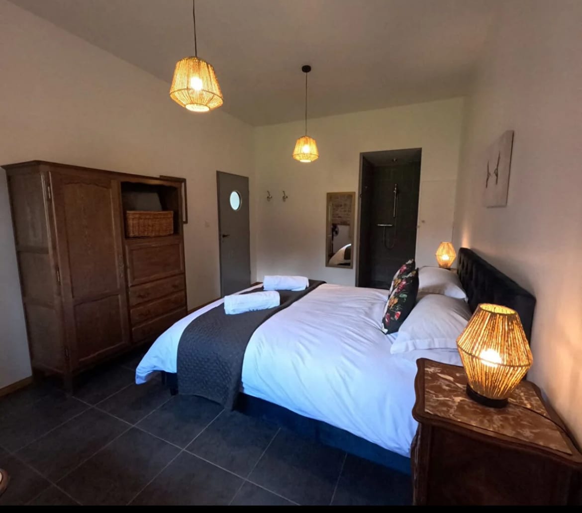 Modern, private  double bedroom with side view of the garden. This bedroom also has the advantage of a walk in shower 