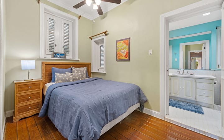 Comfortable queen bedroom located in the main house with easy access to the shared bathroom and living space.