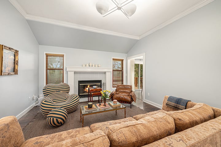 Gather around the fireplace, a charming centerpiece that adds warmth and a cozy ambiance to the living space.