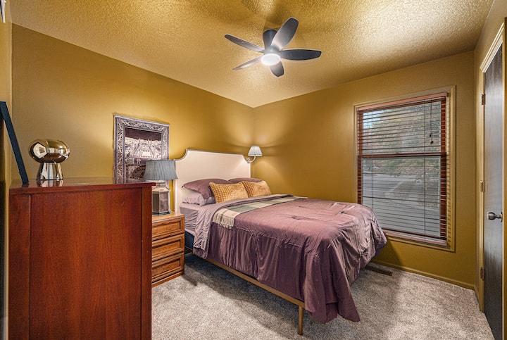 Unwind in a cozy bedroom designed for two, with thoughtfully chosen furnishings that create a warm, comfortable space perfect for rest and relaxation.