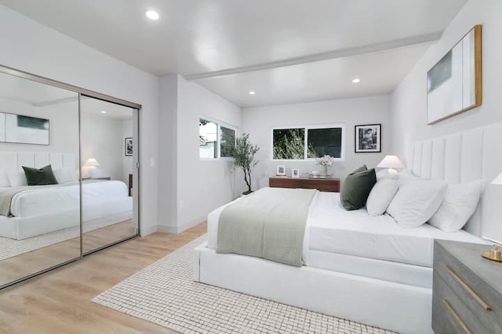 The primary bedroom features a spacious Queen bed