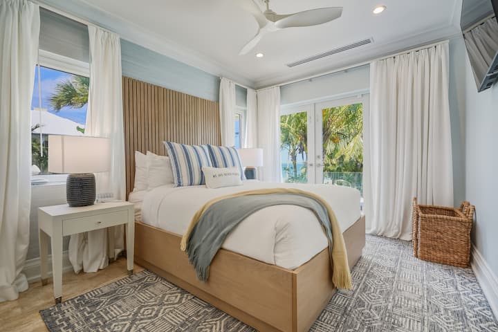 Queen sized bed and TV in Bedroom 2.