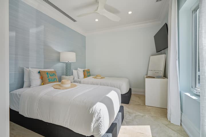 Two single beds with a TV.