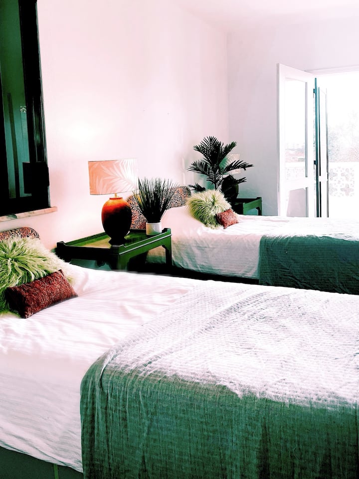 Bedroom 6 is a twin room on the upper level of the pool house.  It has its own ensuite shower room and private balcony with ocean views.
