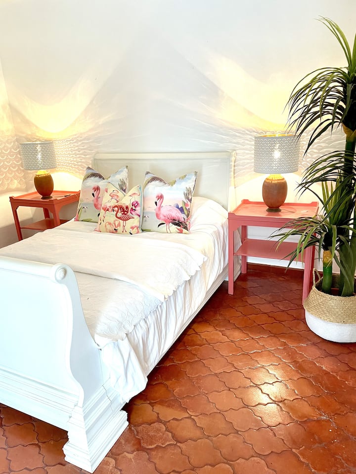 Bedroom 5 is situated in the upper level of the pool house.  It has its own ensuite shower room with private terrace overlooking the east garden.