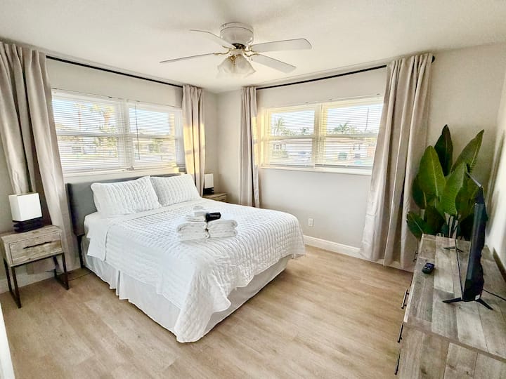Tranquil bedroom fitted with queen sized bed and Smart TV