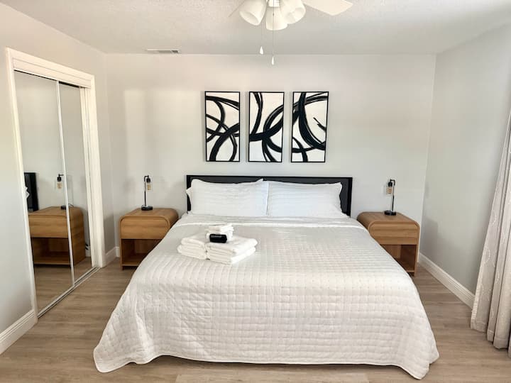 Rest easy in this bedroom fitted with king sized bed, desk and Smart TV