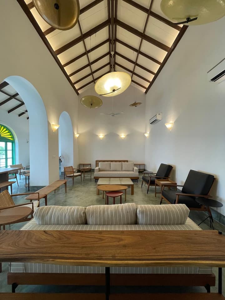Spacious living area with comfortable seating and natural light for relaxation or gatherings.