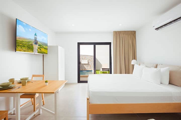 Step into comfort and simplicity—this bright, airy bedroom with modern amenities and a serene view is your perfect home-away-from-home for a restful stay.