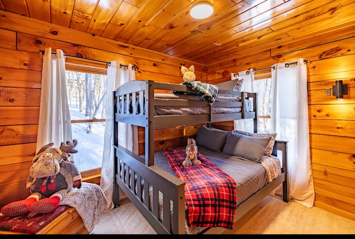 Downstairs: Bunk bed with double bed on bottom and twin on top. Double bunk may not be suitable for two adults