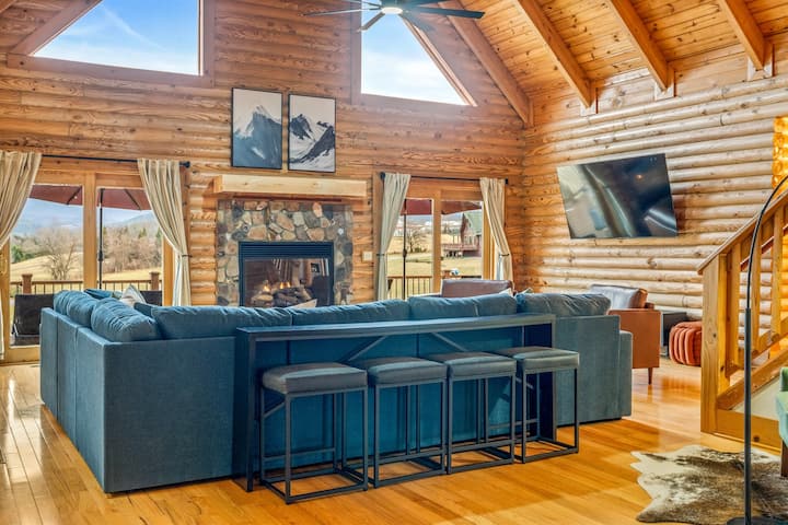 A wall of windows frames the Blue Ridge from gold at sunrise to deep purple at dusk.