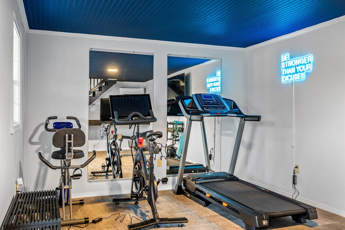 The home gym with a Peloton bike and free weights, ready when you are.