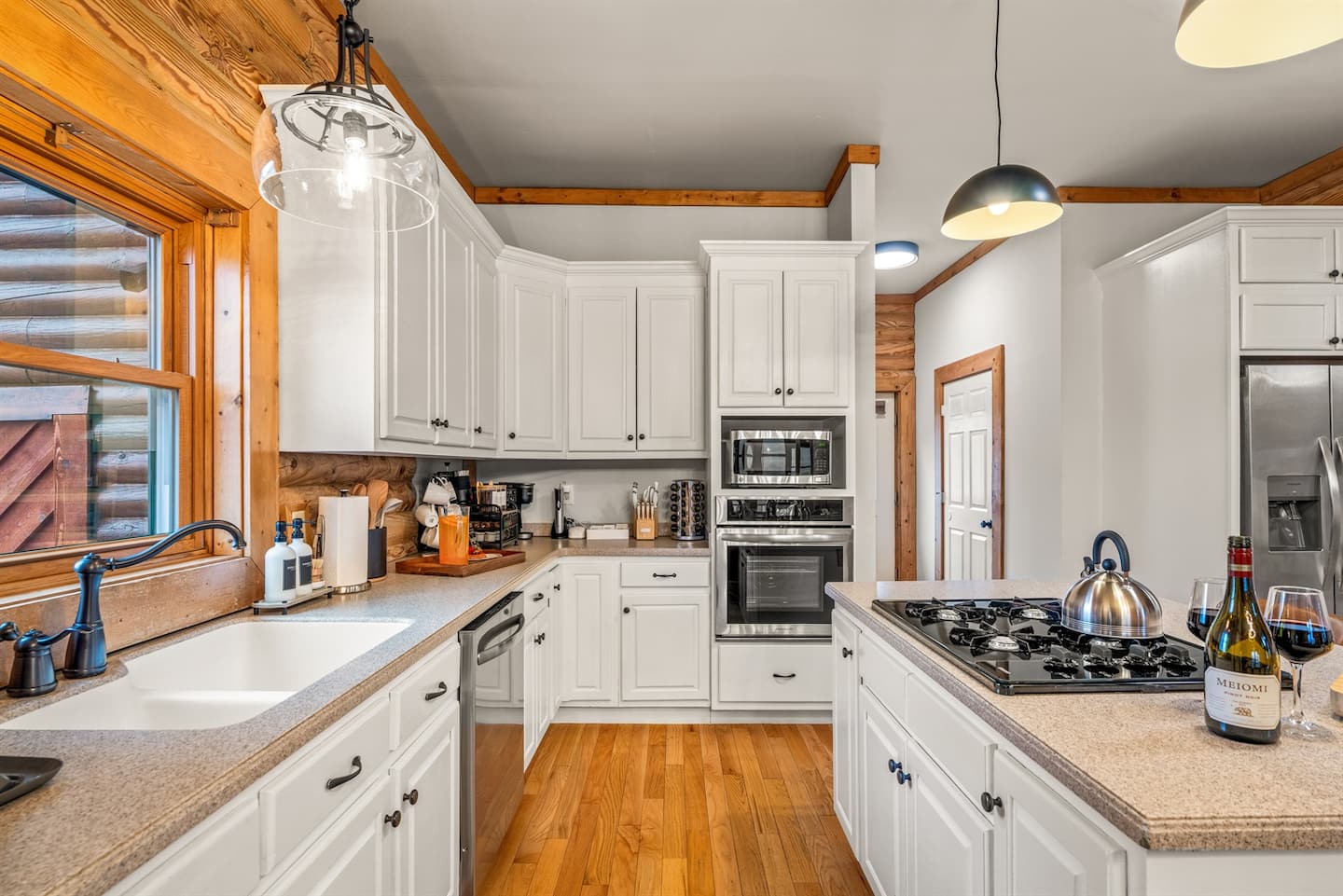 Ample counter space, plenty of cabinets, and everything the group needs to prep meals or host a big dinner.
