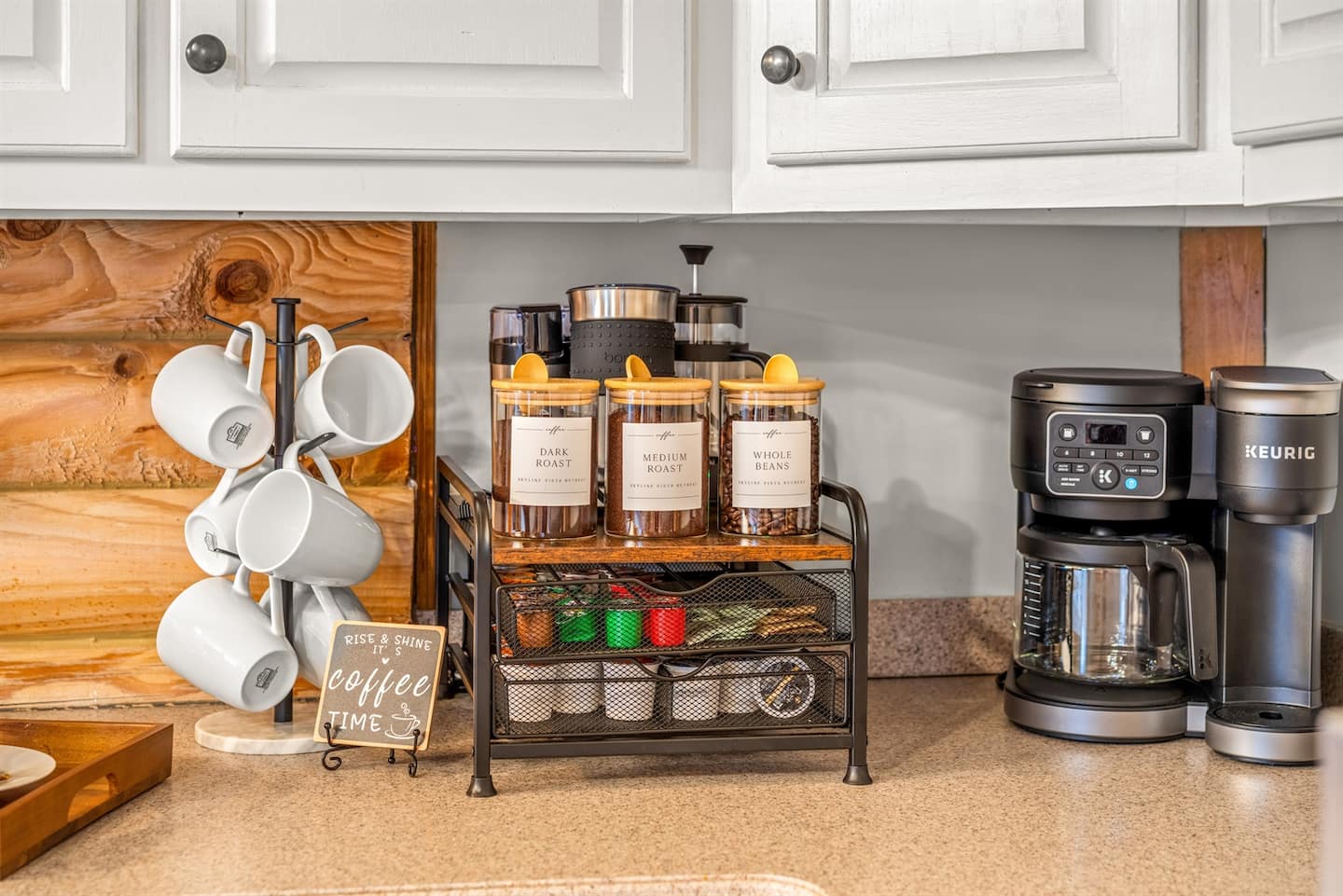 Coffee station stocked and ready with mugs, a coffee maker, and essentials to start the day with ease.