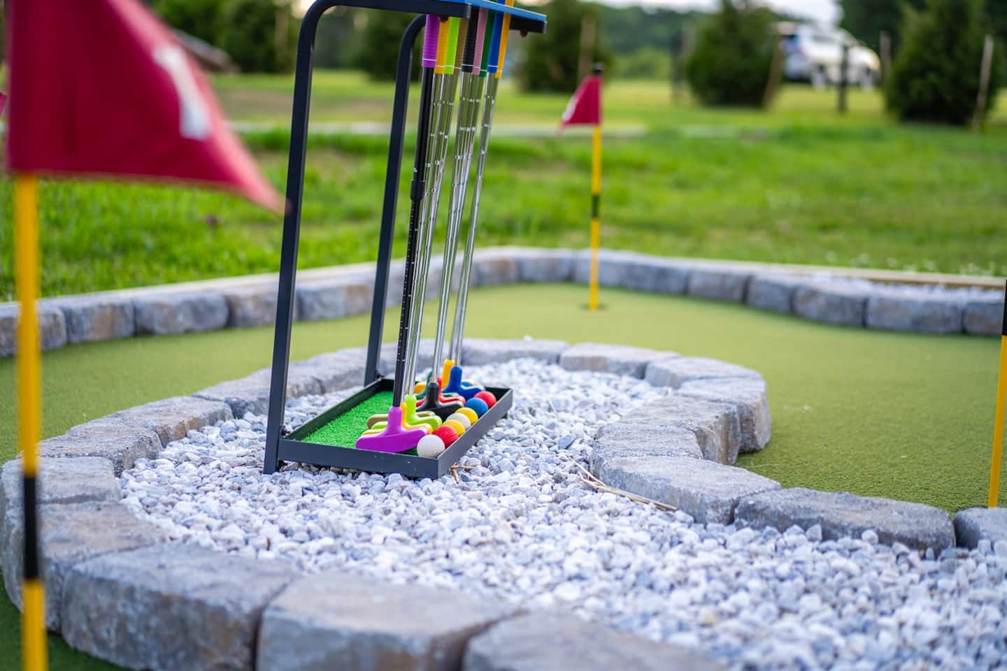Kids and adults compete on the backyard putting green and mini-golf hole — low stakes, big laughs.