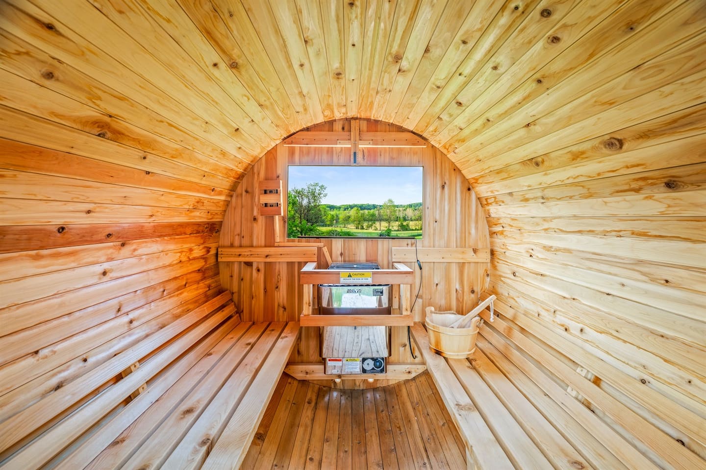 The private barrel sauna: warm cedar, peaceful views, and a full-body reset after a day out.