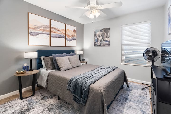 Comfortable queen bed w/luxury linens & extra blankets for a restful night.  Full closet with hangers & luggage rack along with a storage cabinet allow you to move out of your suitcase & into our home.  32" TV allows for late night binge watching.