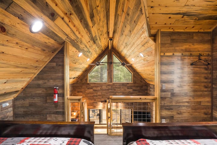 Gaze up through the peaked window from the loft's two full beds