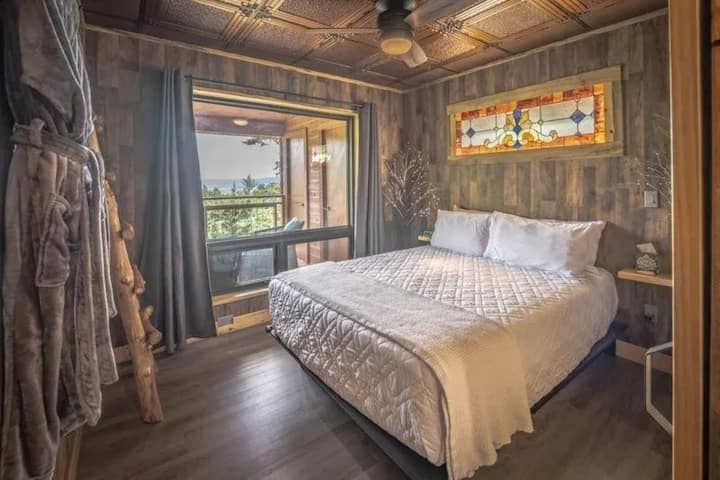 Wake up in the queen bedroom beneath the glowing stained glass
